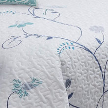 Load image into Gallery viewer, Bring the outside in with this beautiful and elegant quilt set. Subtle refreshing purple and teal spring blossoms are set on a white background.