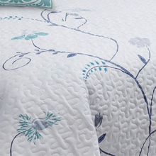 Load image into Gallery viewer, Bring the outside in with this beautiful and elegant quilt set. Subtle refreshing purple and teal spring blossoms are set on a white background.
